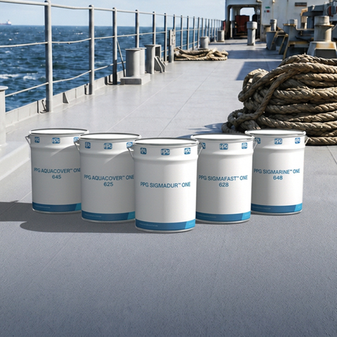 Five PPG marine coating products arranged on the deck of a ship, with the ocean and ship equipment in the background.